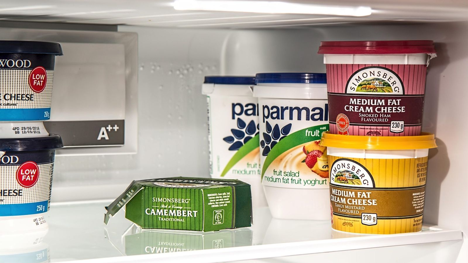 Household refrigerator in a kitchen