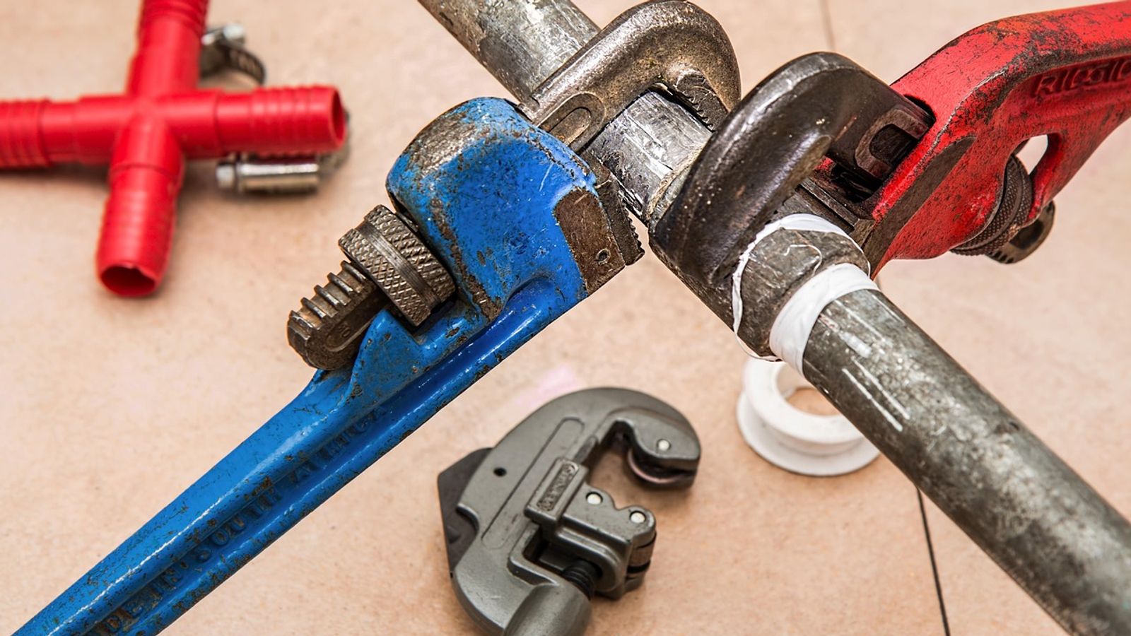 Plumbing tools prepared for a toilet fill-valve replacement