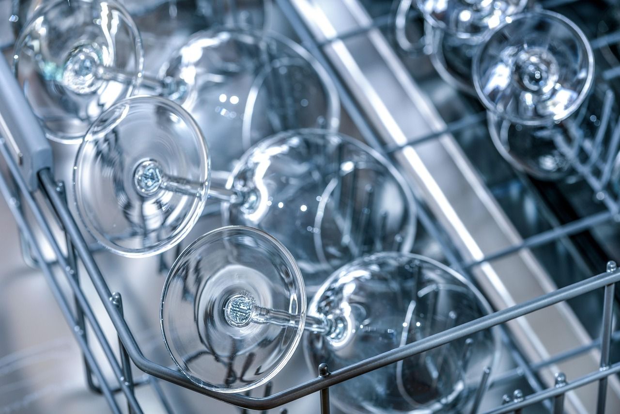 Open household dishwasher in a residential kitchen