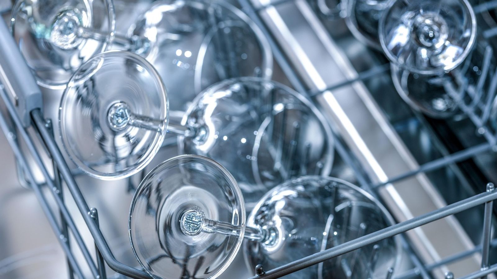 Open household dishwasher in a residential kitchen