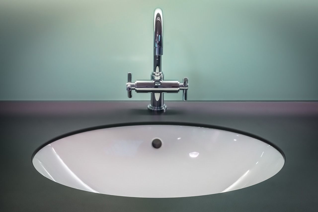 Bathroom sink above the cabinet where a slow leak may occur