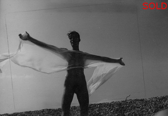 A male figure in silhouette holding wet cloth [P15]