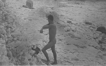Male nude on white rocks [P8]