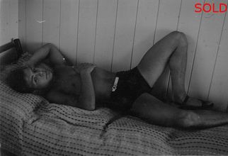 Young man lying on cot [P7]