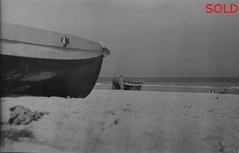 Dick Vaughan in the distance standing beside boat [P61]