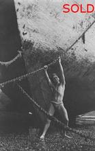 Male bather pulling on anchor chain [P36]