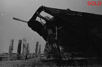 Wreck of fishing boat on beach [P60]