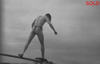 A male figure walking on a plank [P18]