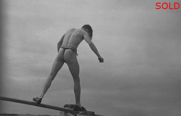 A male figure walking on a plank [P18]