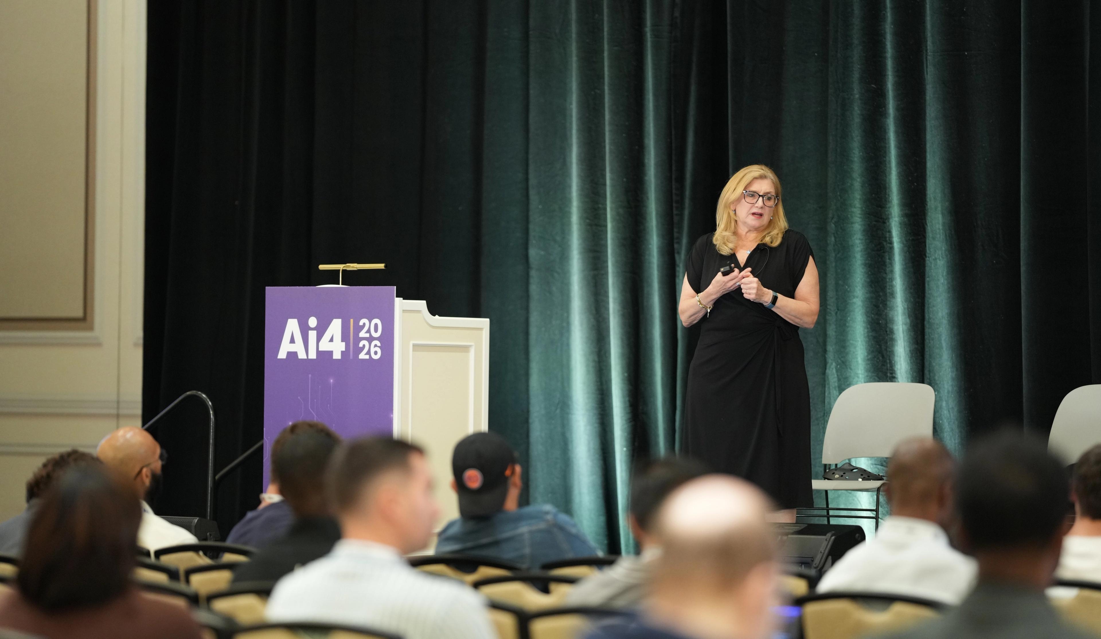 JoAnn Stonier speaking on stage at the Ai4 conference in Las Vegas