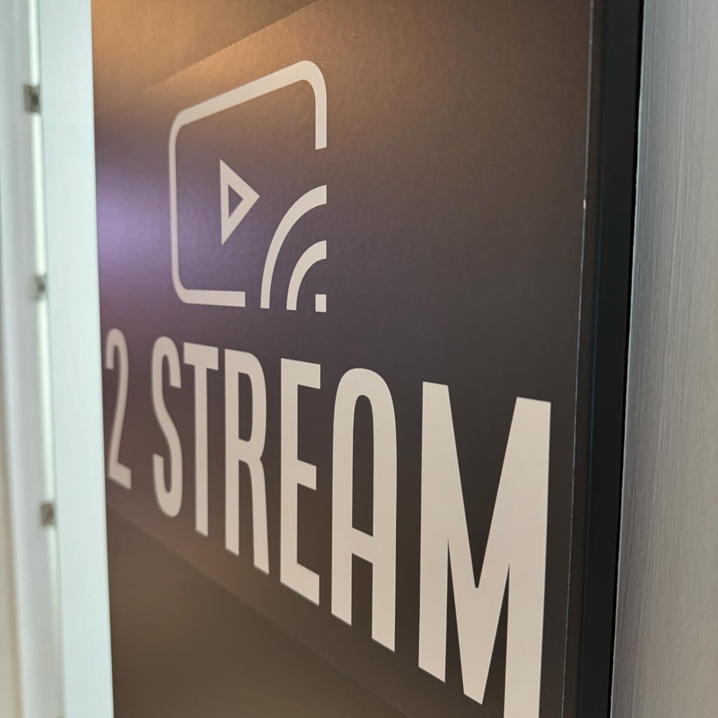 The 2 Stream logo on a sign at the entrance to the office