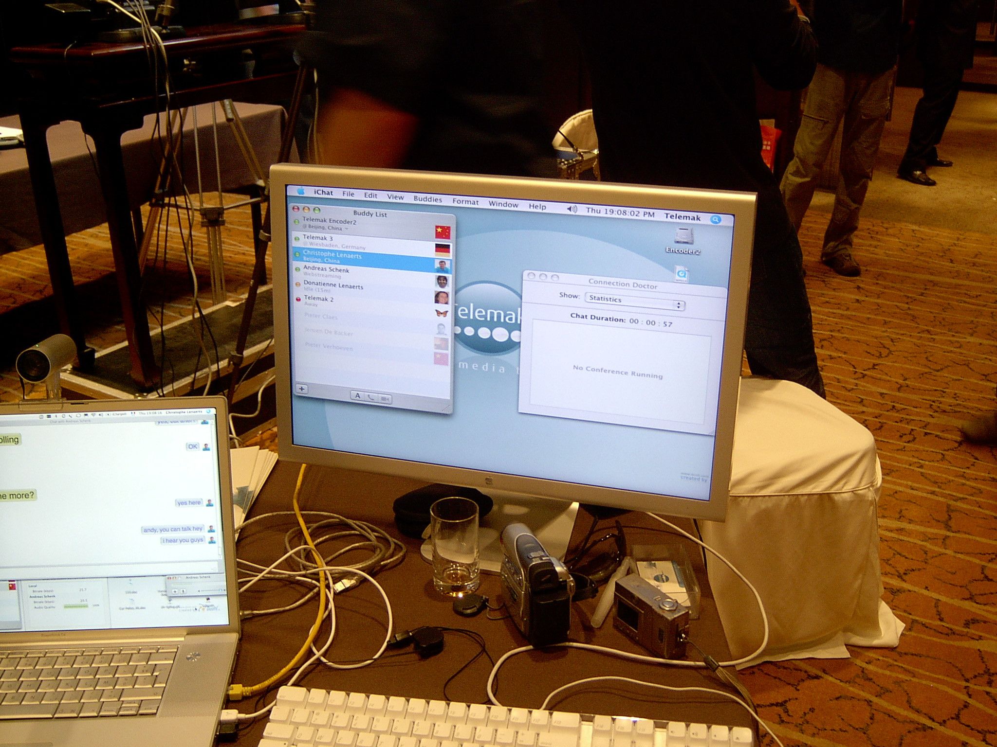 iChat buddy list on a Telemak workstation showing encoders in Beijing, with a laptop chat beside it