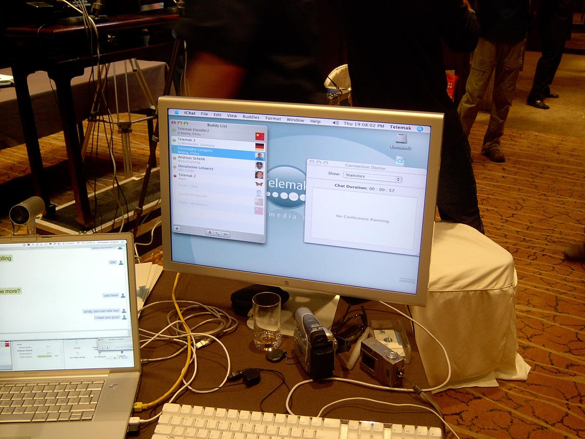 iChat buddy list on a Telemak workstation showing encoders in Beijing, with a laptop chat beside it