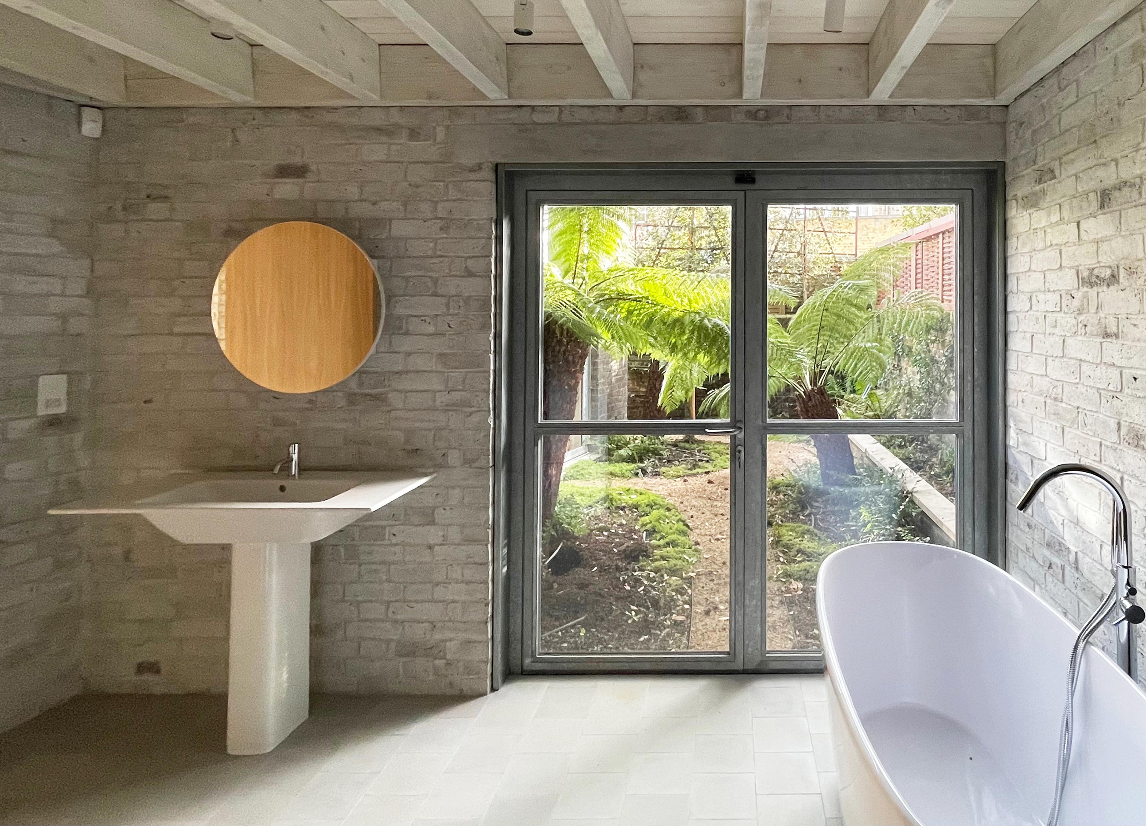 The bathroom opens out to the private courtyard