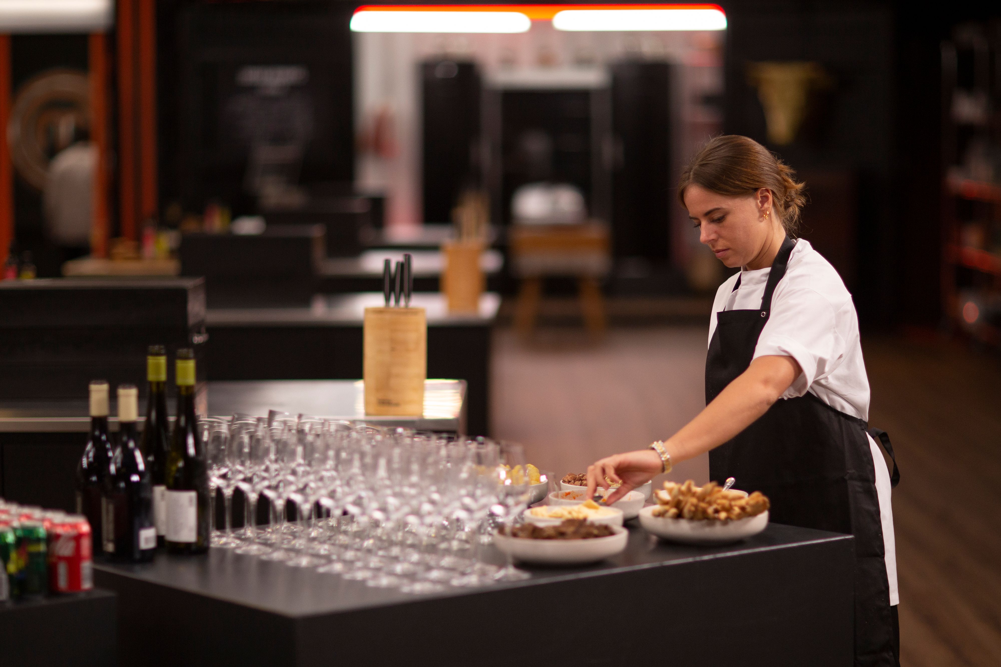 Individual setting up snacks