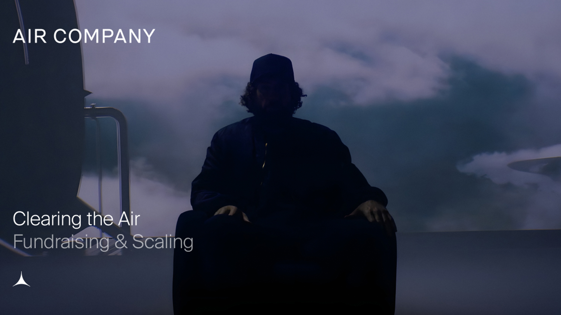 Silhouetted figure in a dark hat and cloak against a cloudy sky, with text 'AIR COMPANY', 'Clearing the Air', 'Fundraising & Scaling'.