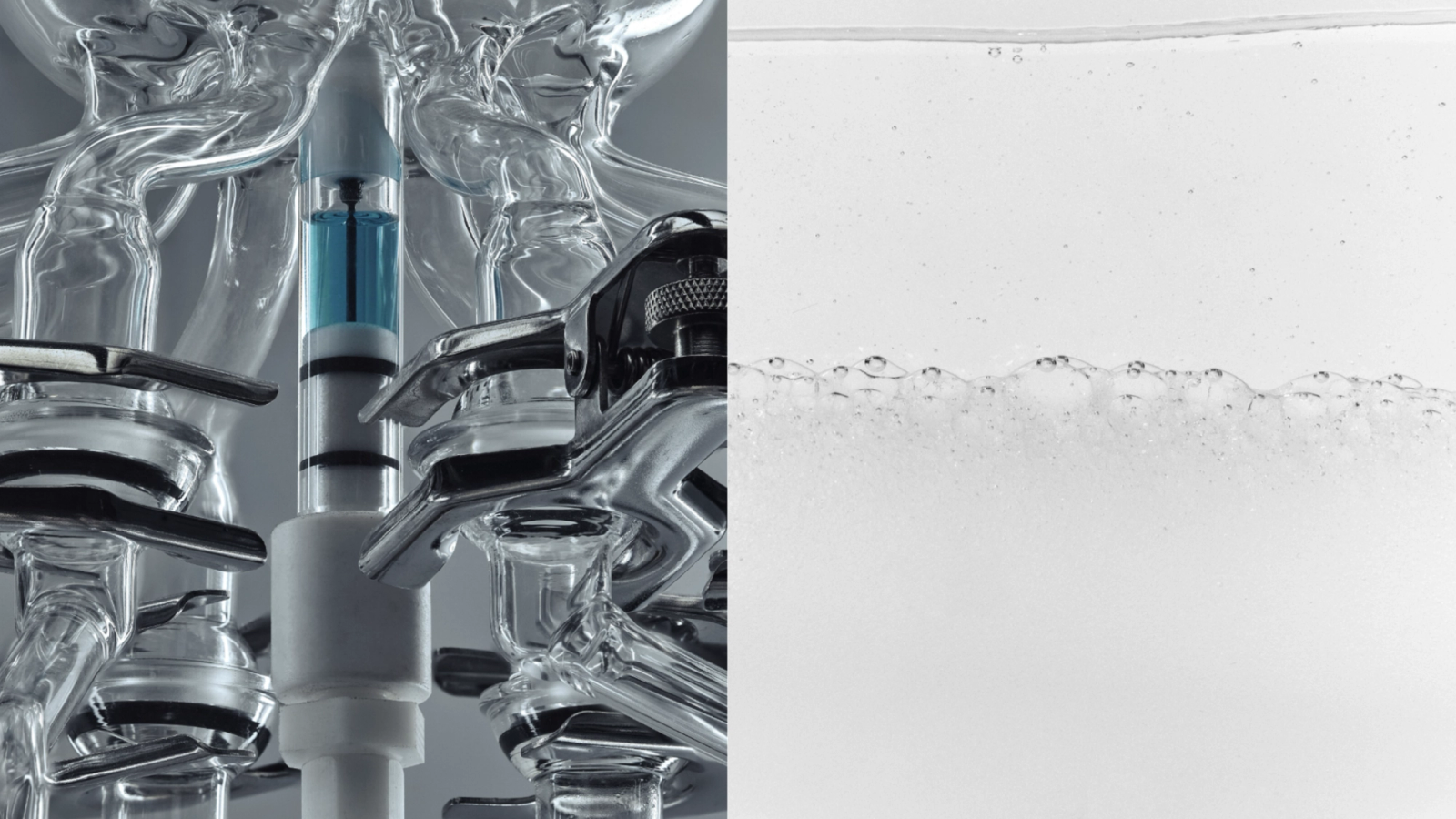 Laboratory glassware with a blue device on the left, and a clear liquid with bubbles on the right.