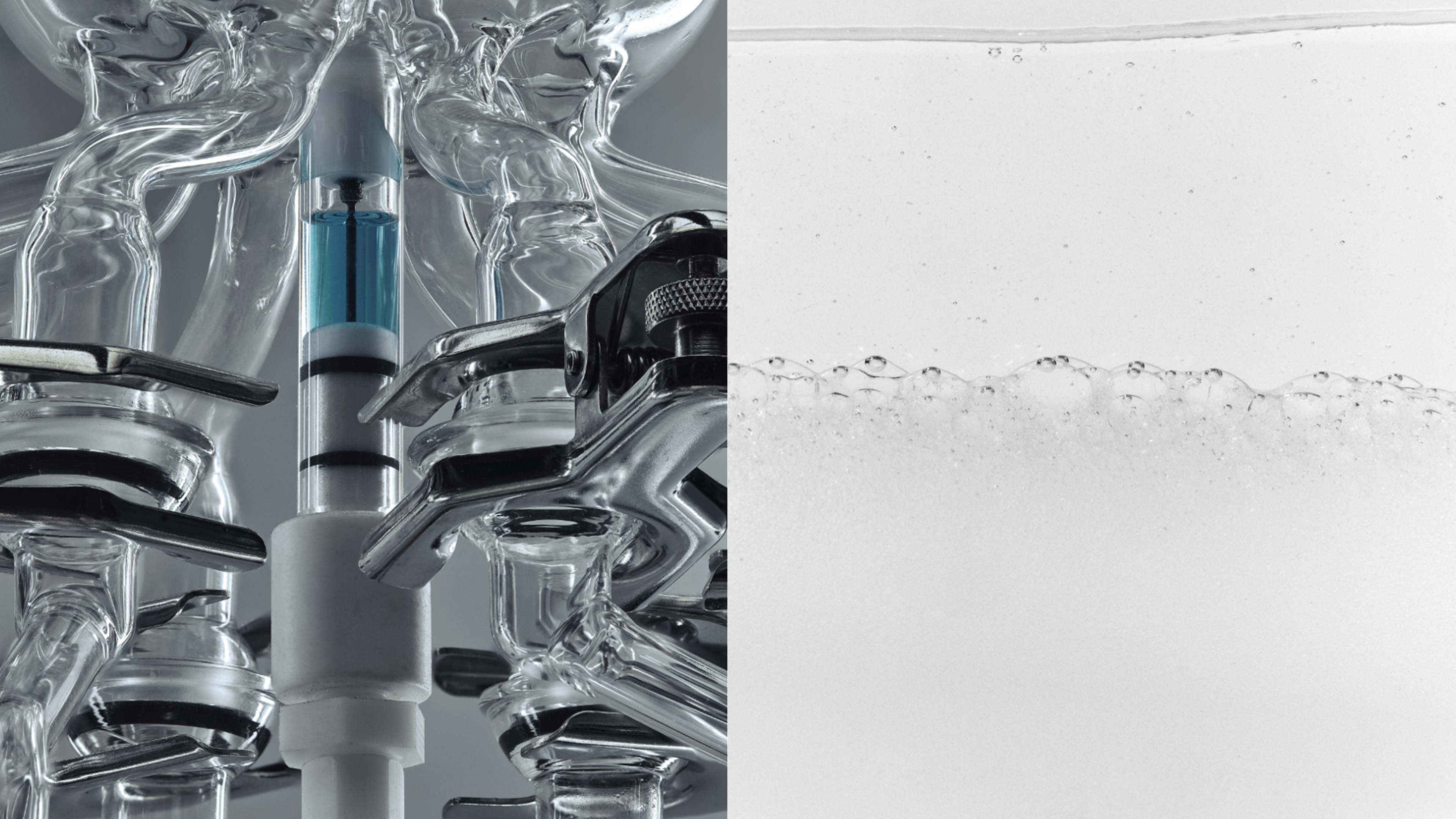 Laboratory glassware with a blue device on the left, and a clear liquid with bubbles on the right.