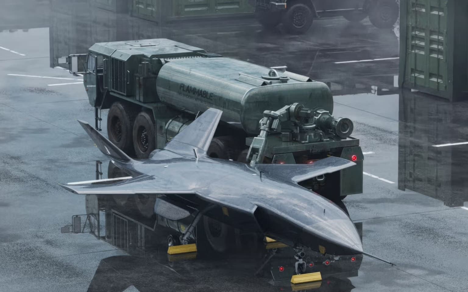 A futuristic dark gray jet aircraft sits on a wet tarmac with a military fuel truck behind it.