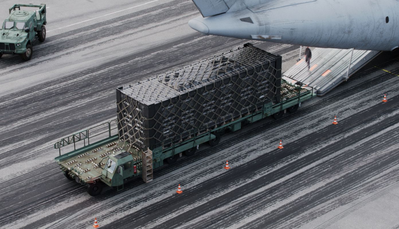 AIRCO MAD Fuel System being loaded into the rear of a military plane