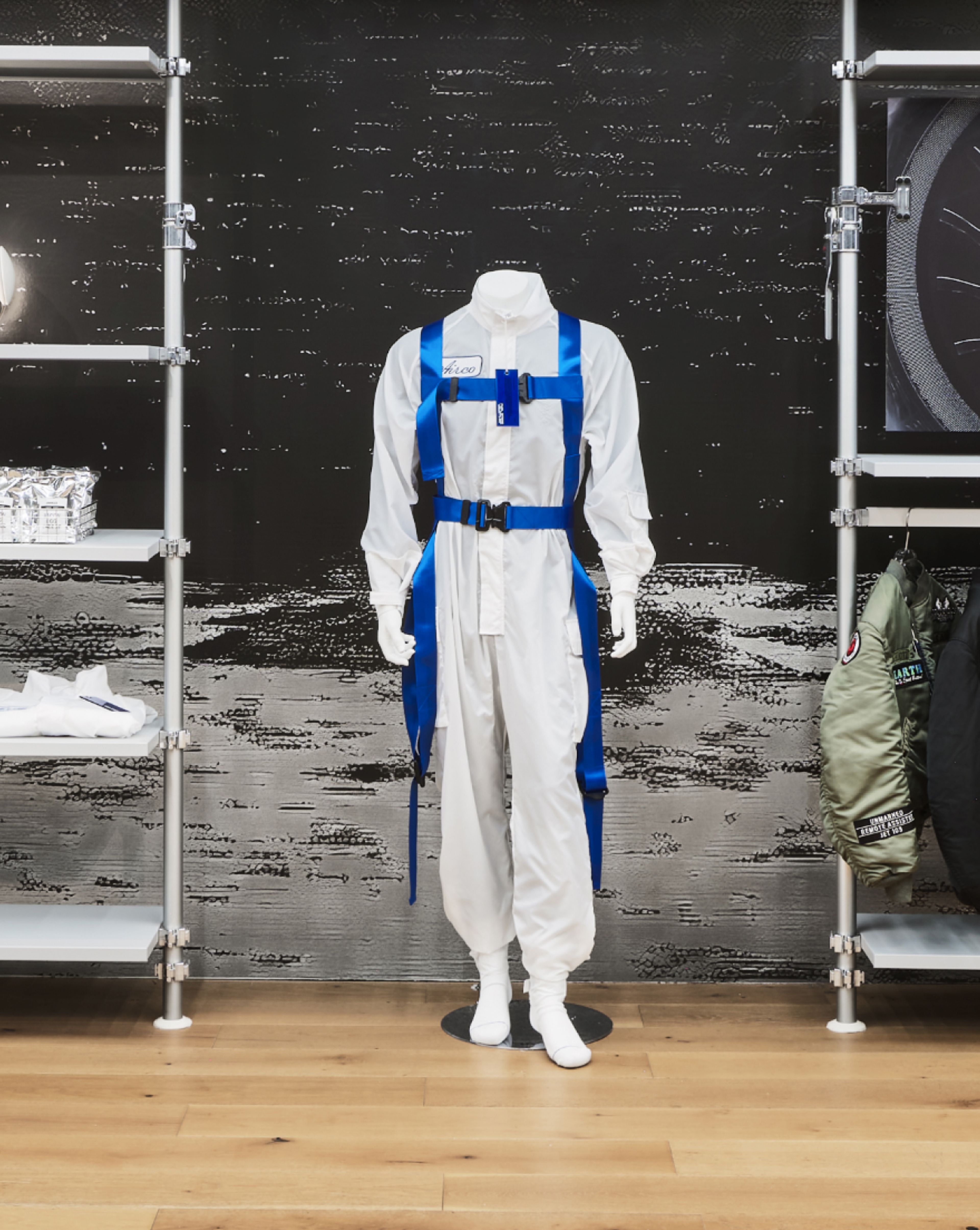 mannequin wearing a white one-piece suit