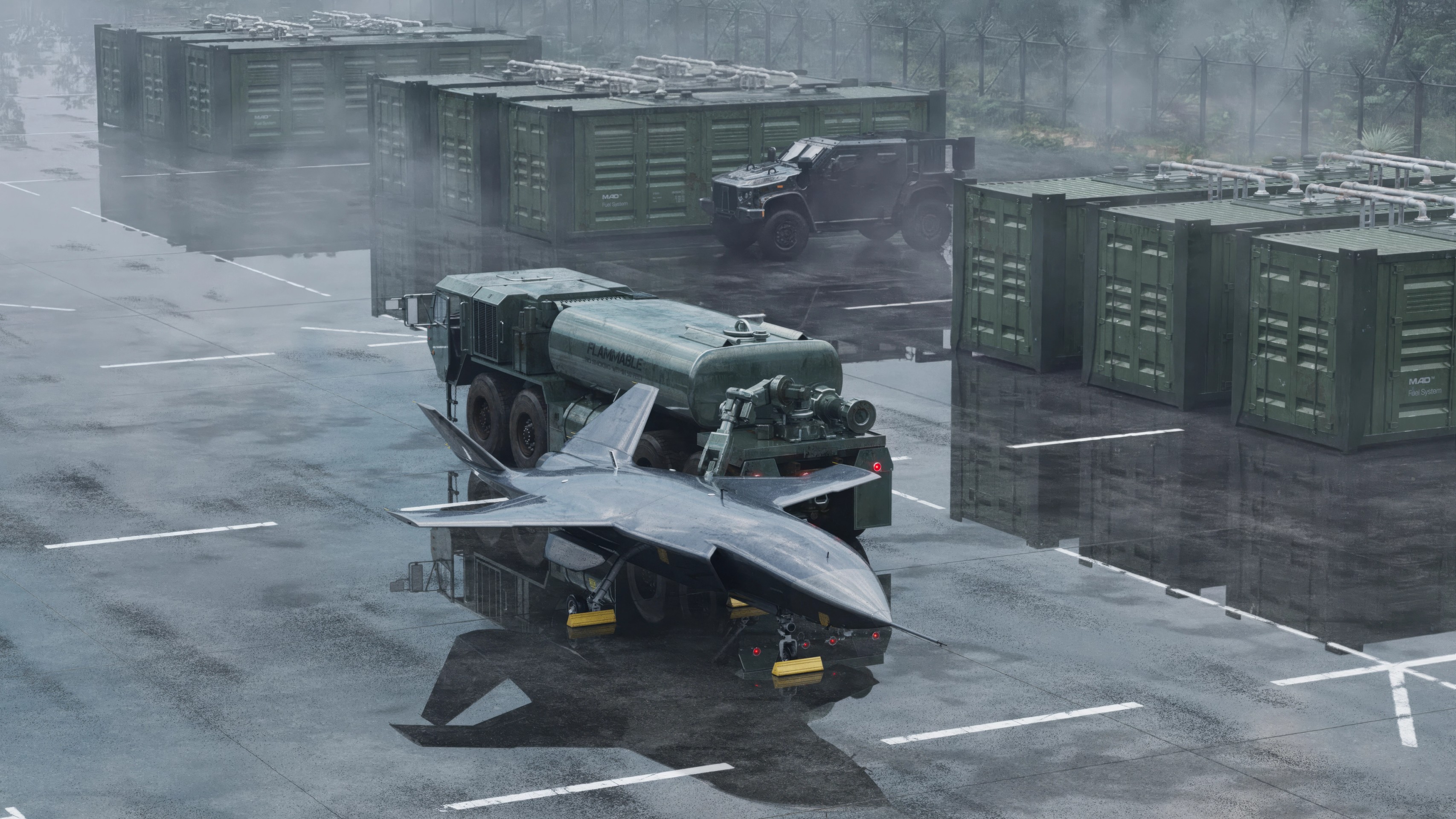 A dark stealth jet and fuel tanker parked on a rainy airfield with green containers.