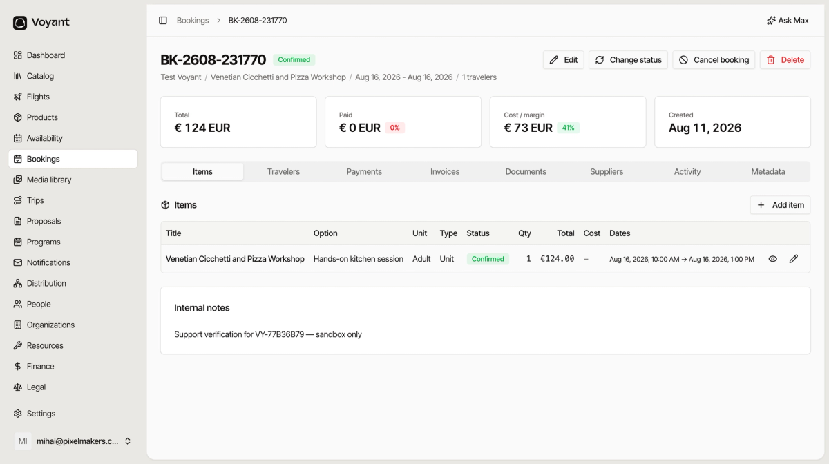A booking page showing the reference, confirmed status, summary cards for total, paid, cost and margin, and eight tabs with the Items tab open
