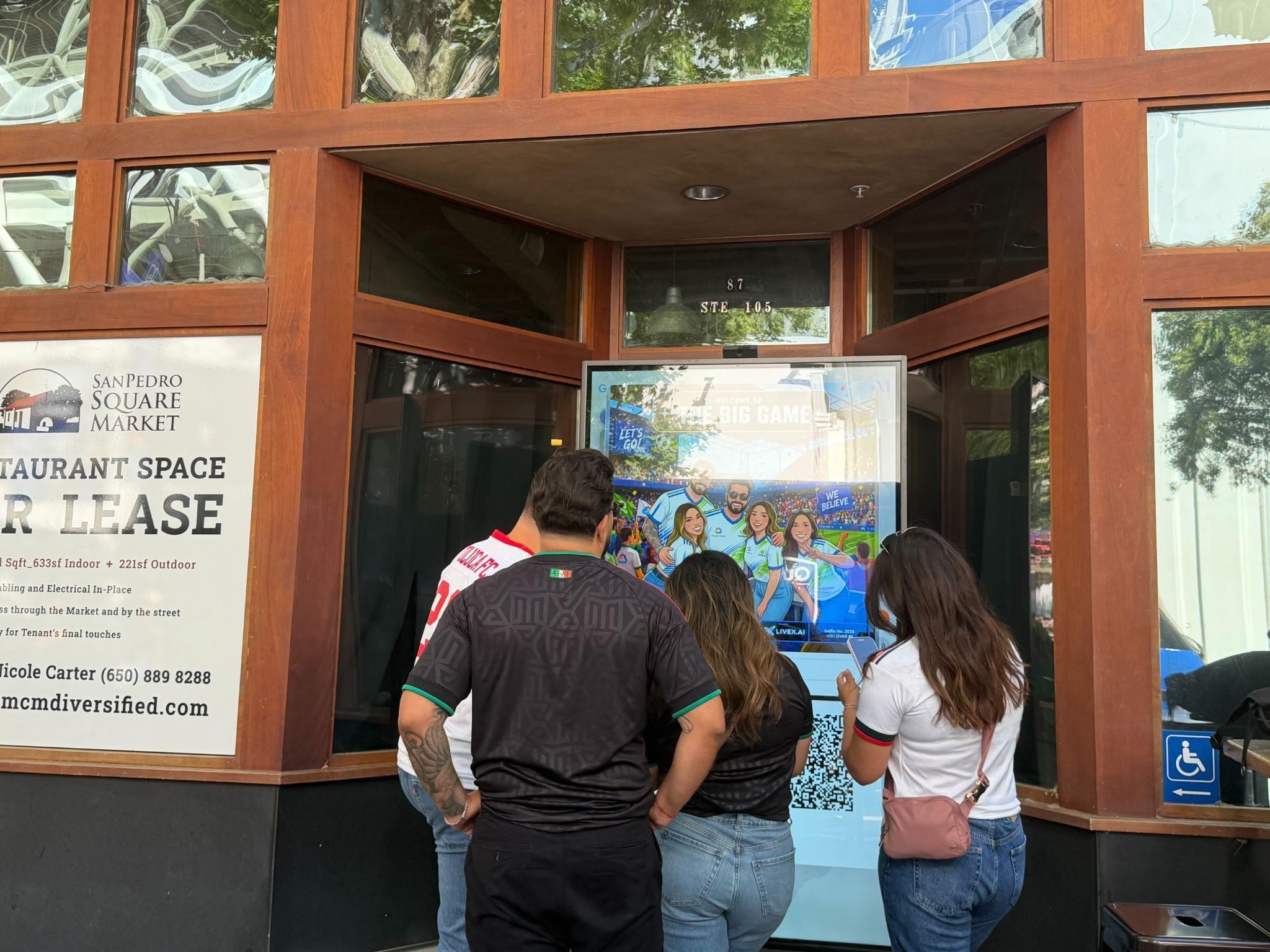 Fans enjoying the group selfie experience at the San Pedro Square Fan Zone