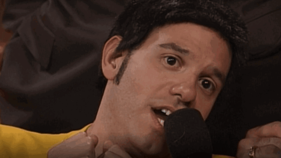 An Image from Mr. Show with Bob and David that has David Cross playing a character who spends his life in a wheelchair and the image says “‘Cause I don’t wanna stand up”