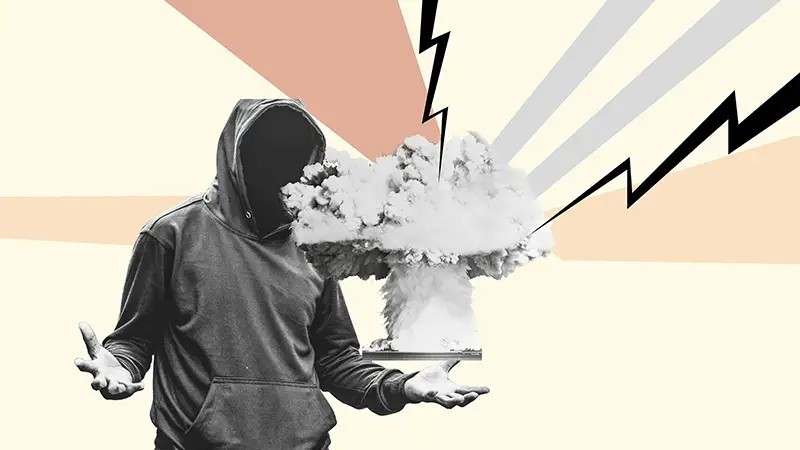Person in hoodie with no face, holding their hands up in frustration. Explosion graphics surrounding.