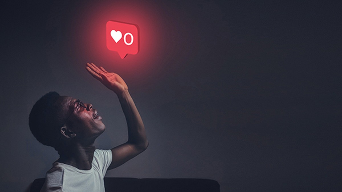 Man with social media 'love reaction' symbol