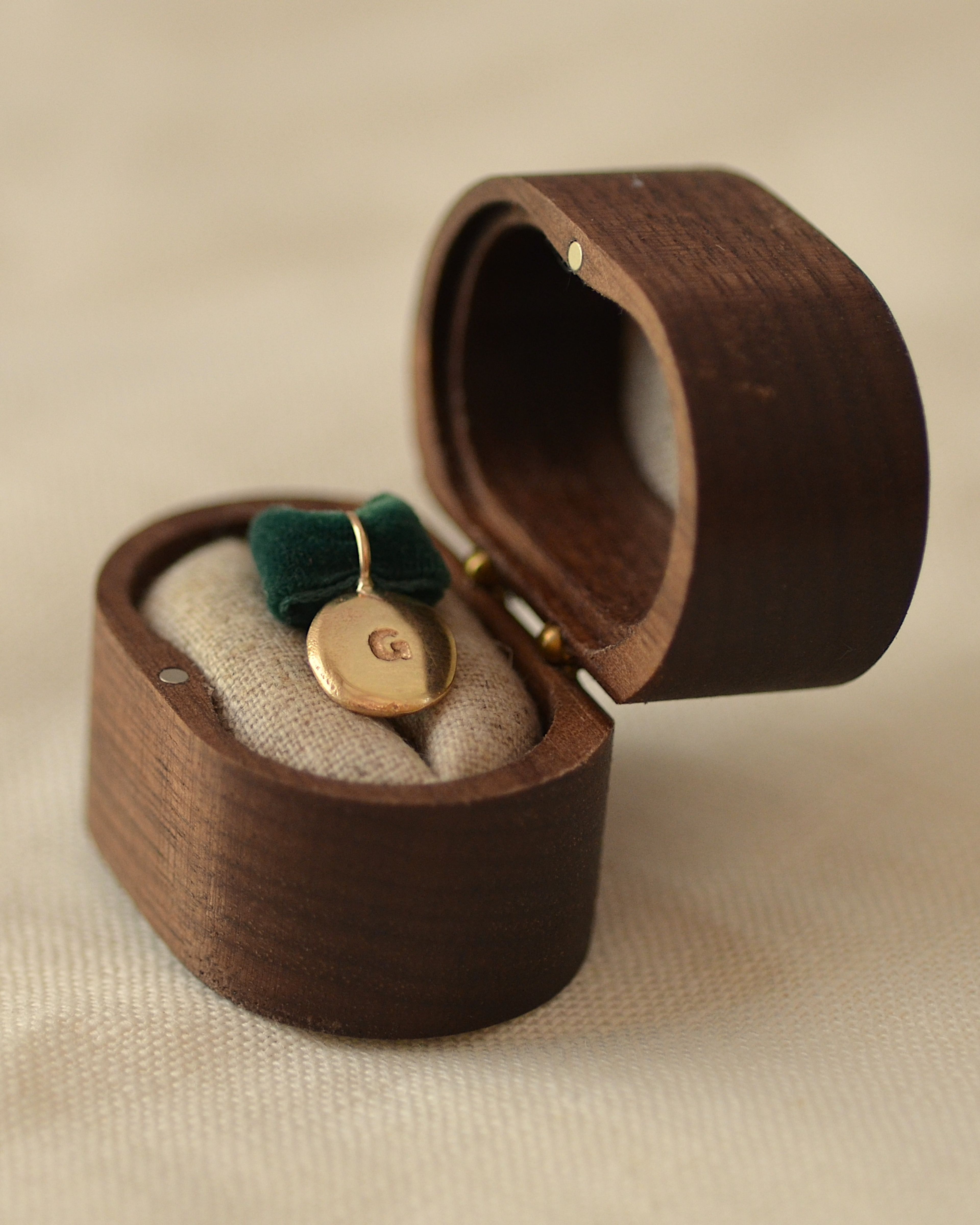 Gold pendant in handmade wooden presentation box