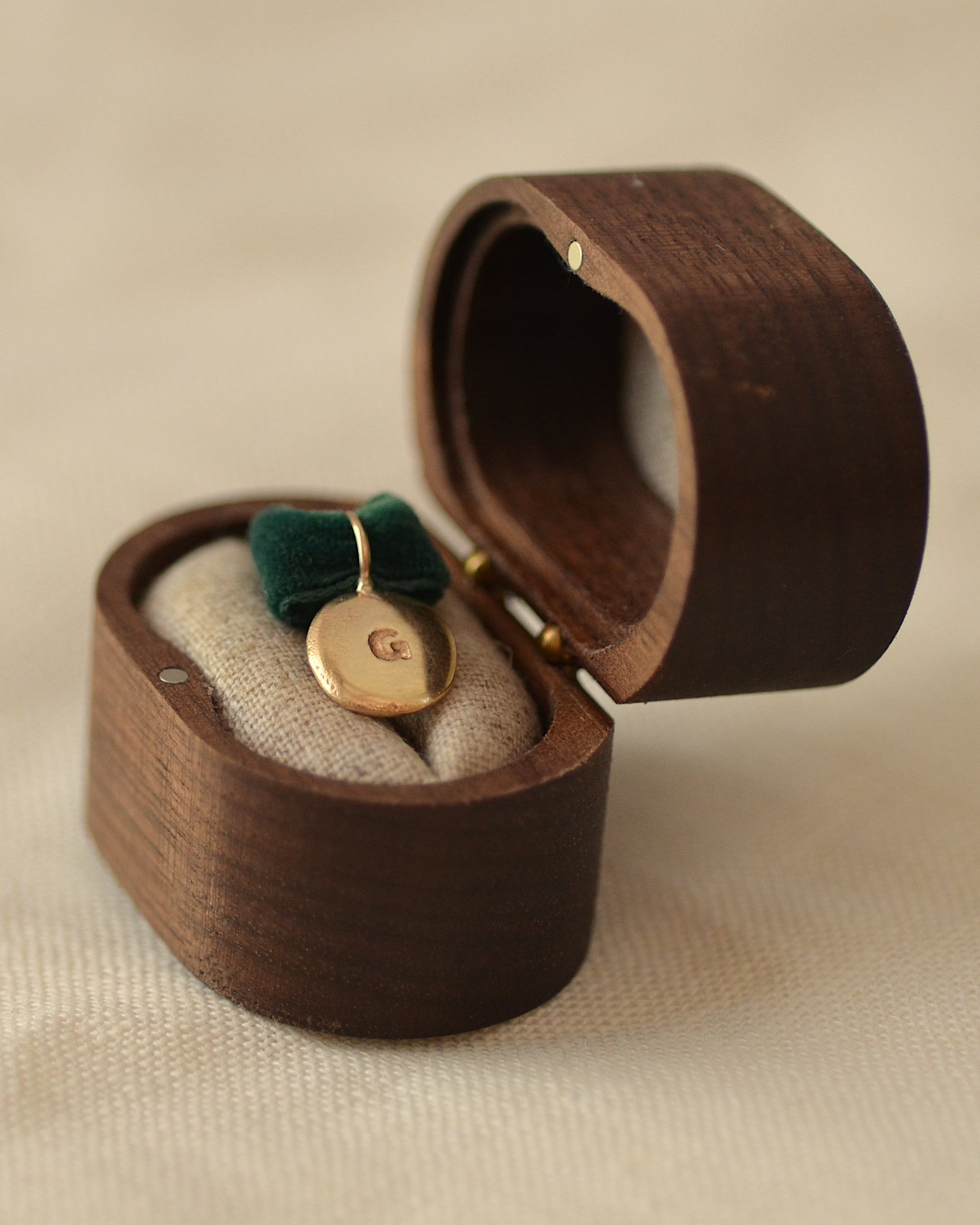 Gold pendant in handmade wooden presentation box