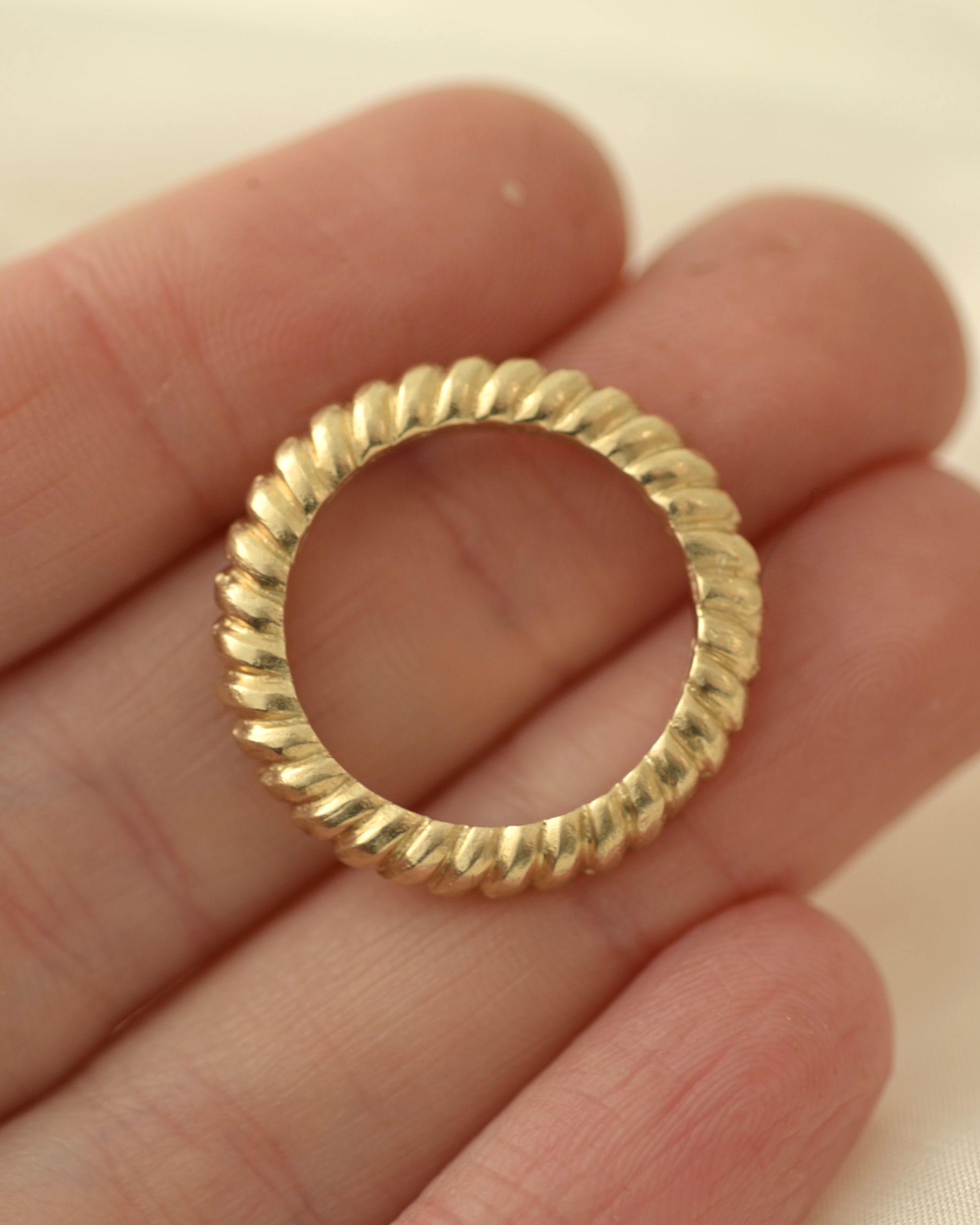 Ridge ring held in hand showing size