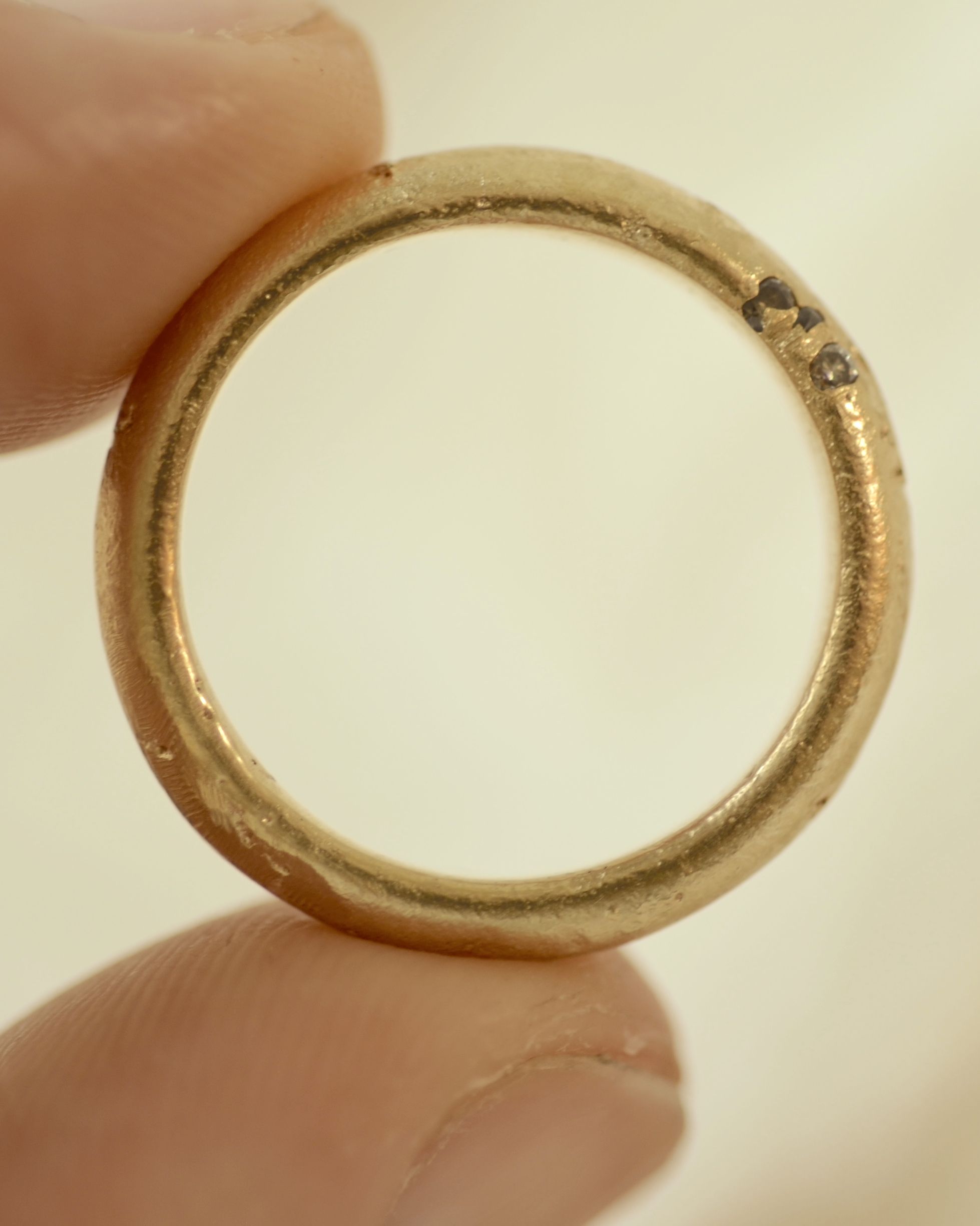Cast ring held between fingers