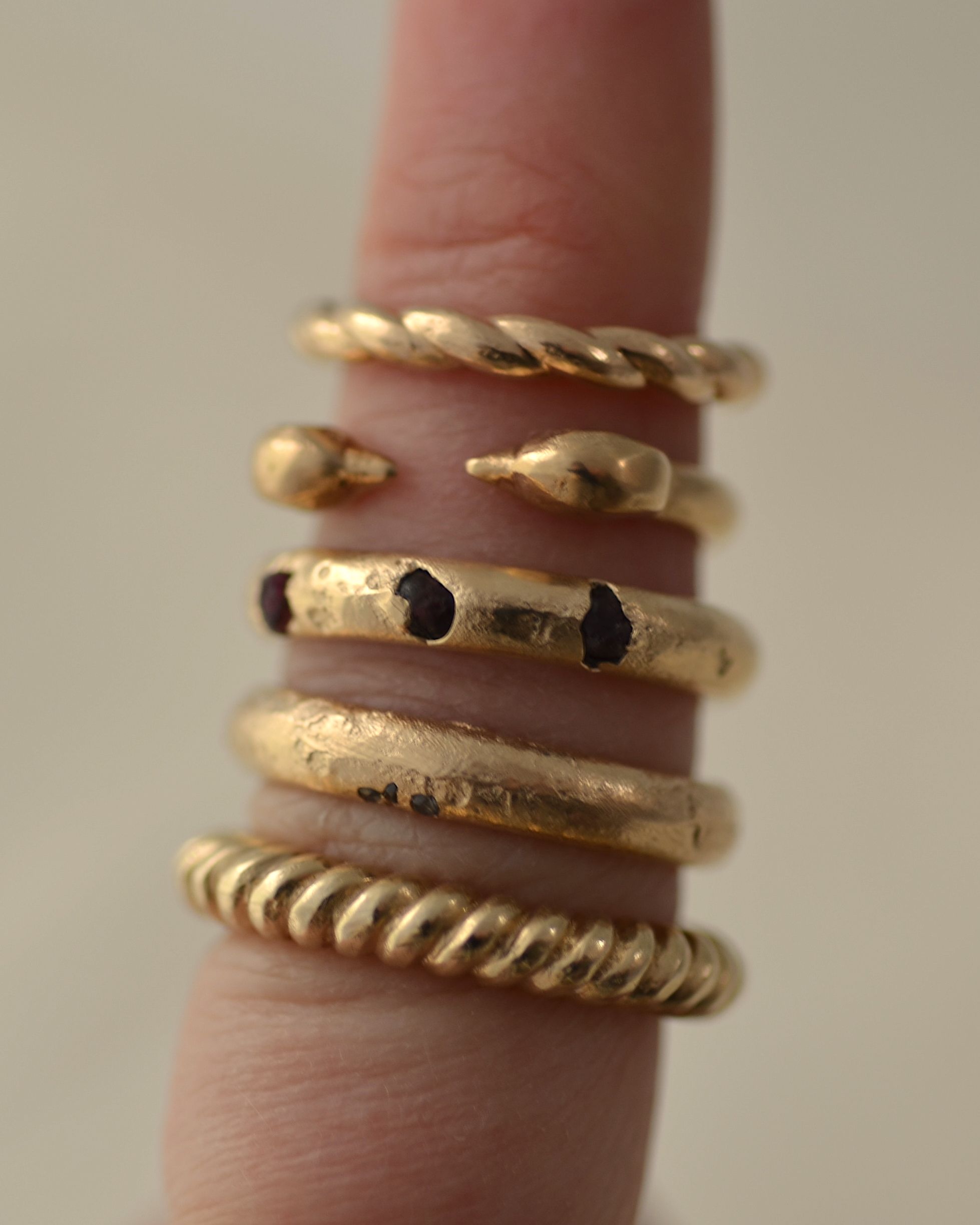 Ridge ring stacked on finger with other rings