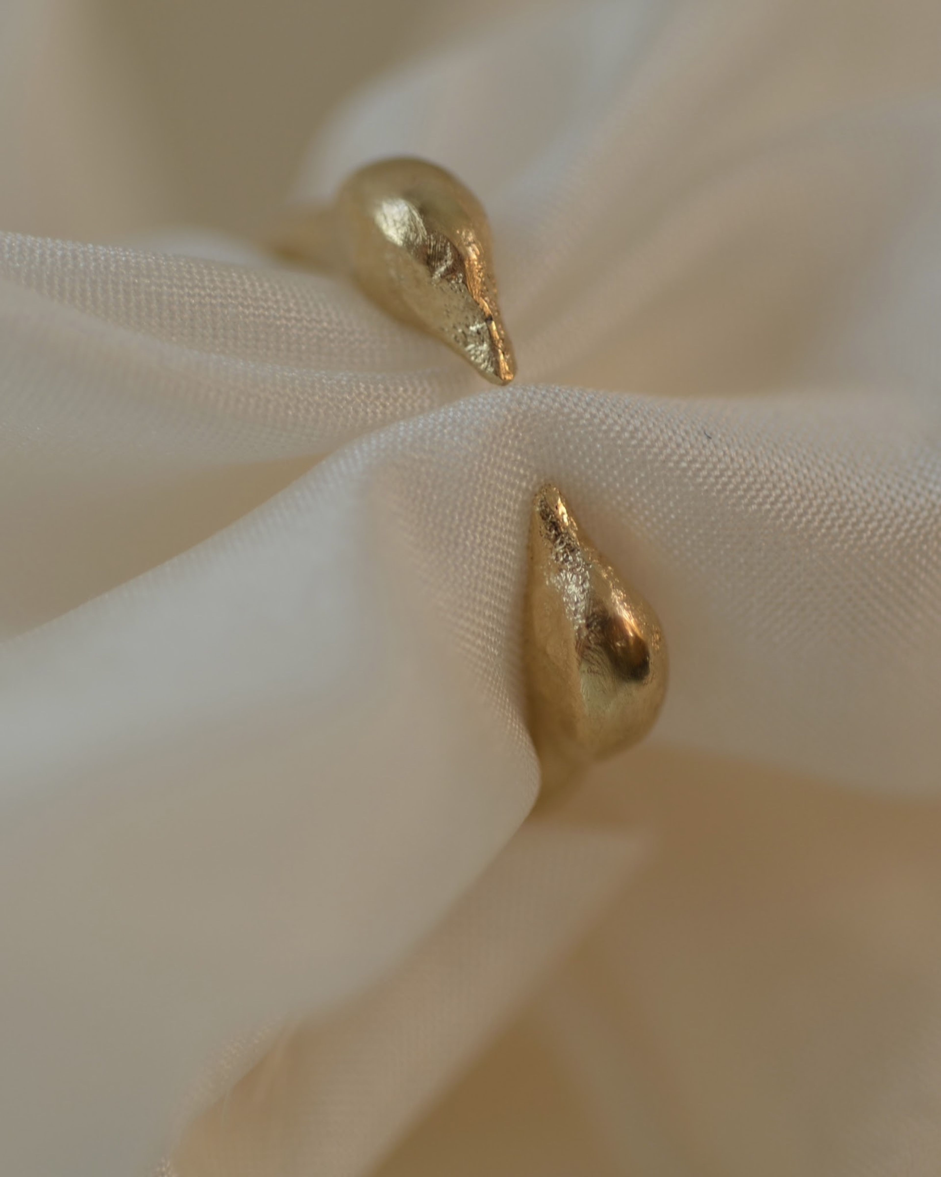 The Sentinels Ring on cream silk