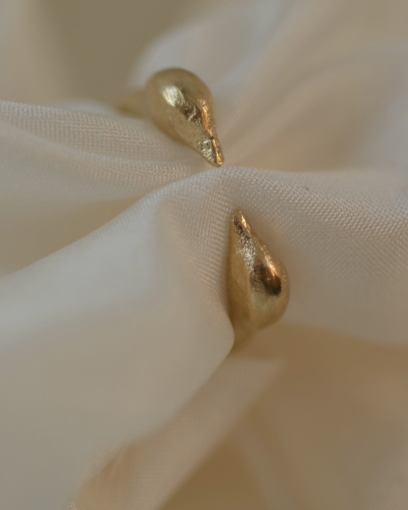 The Sentinels Ring on cream silk