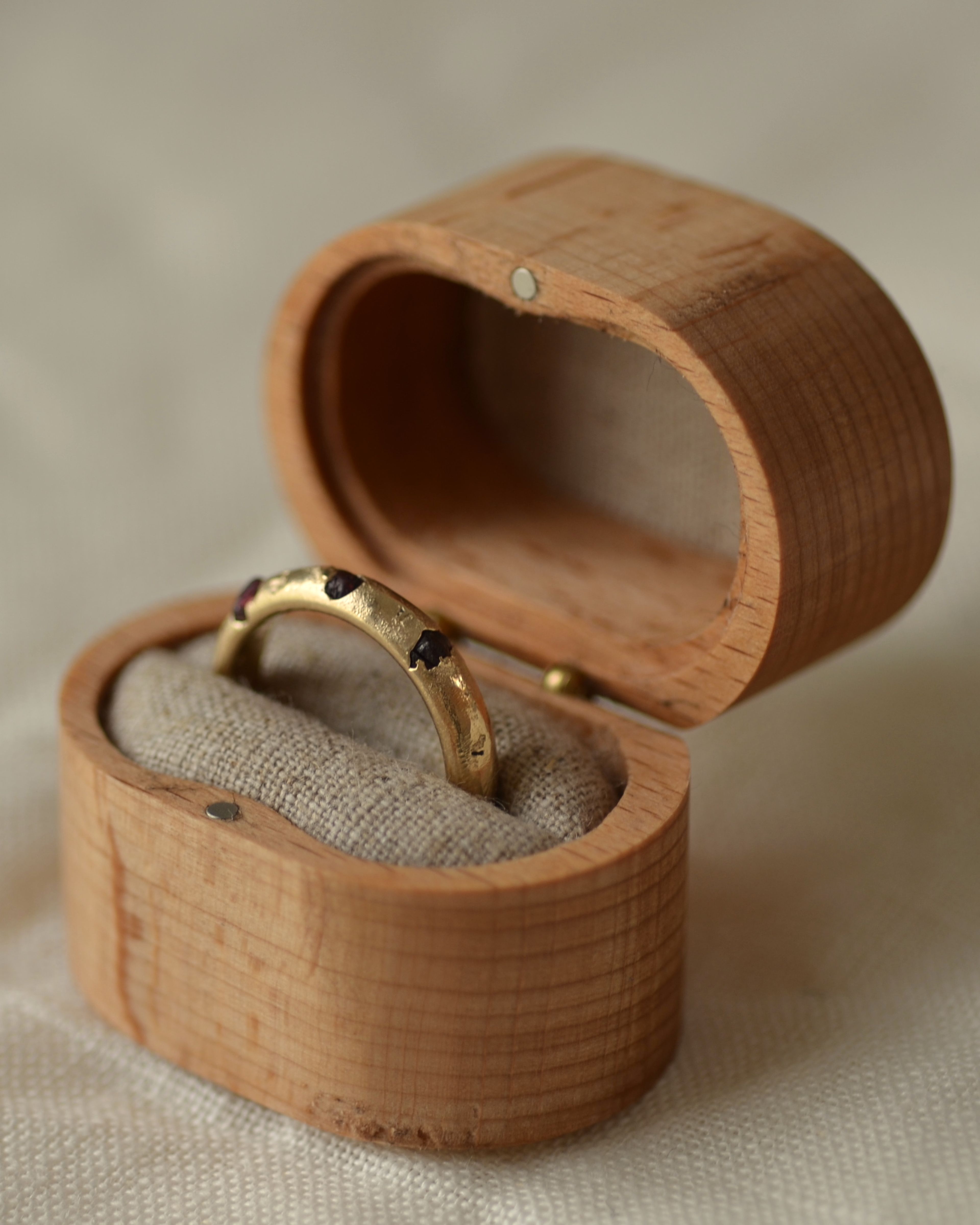 Riverbed garnet ring in sustainable New Zealand made keepsake ring box with natural linen fabric