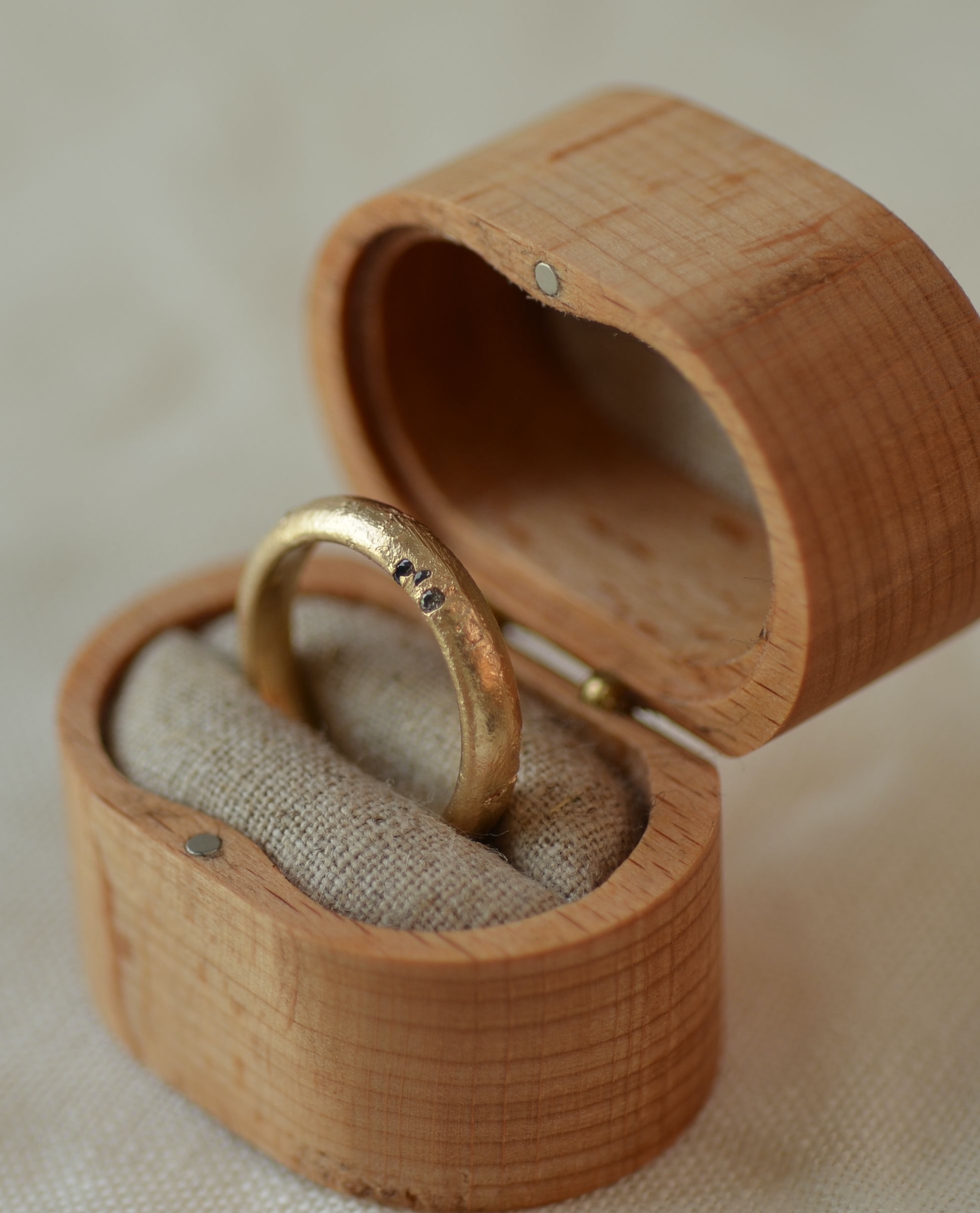Cast ring in wooden presentation box