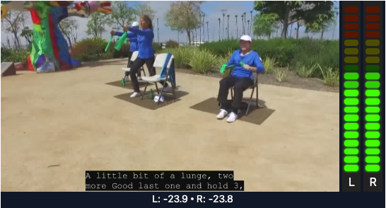 Screenshot of a video playing in Cablecast with closed captions visible at the bottom of the screen, along with audio level meters on the right side, illustrating caption text timing and audio monitoring during closed captioning testing.