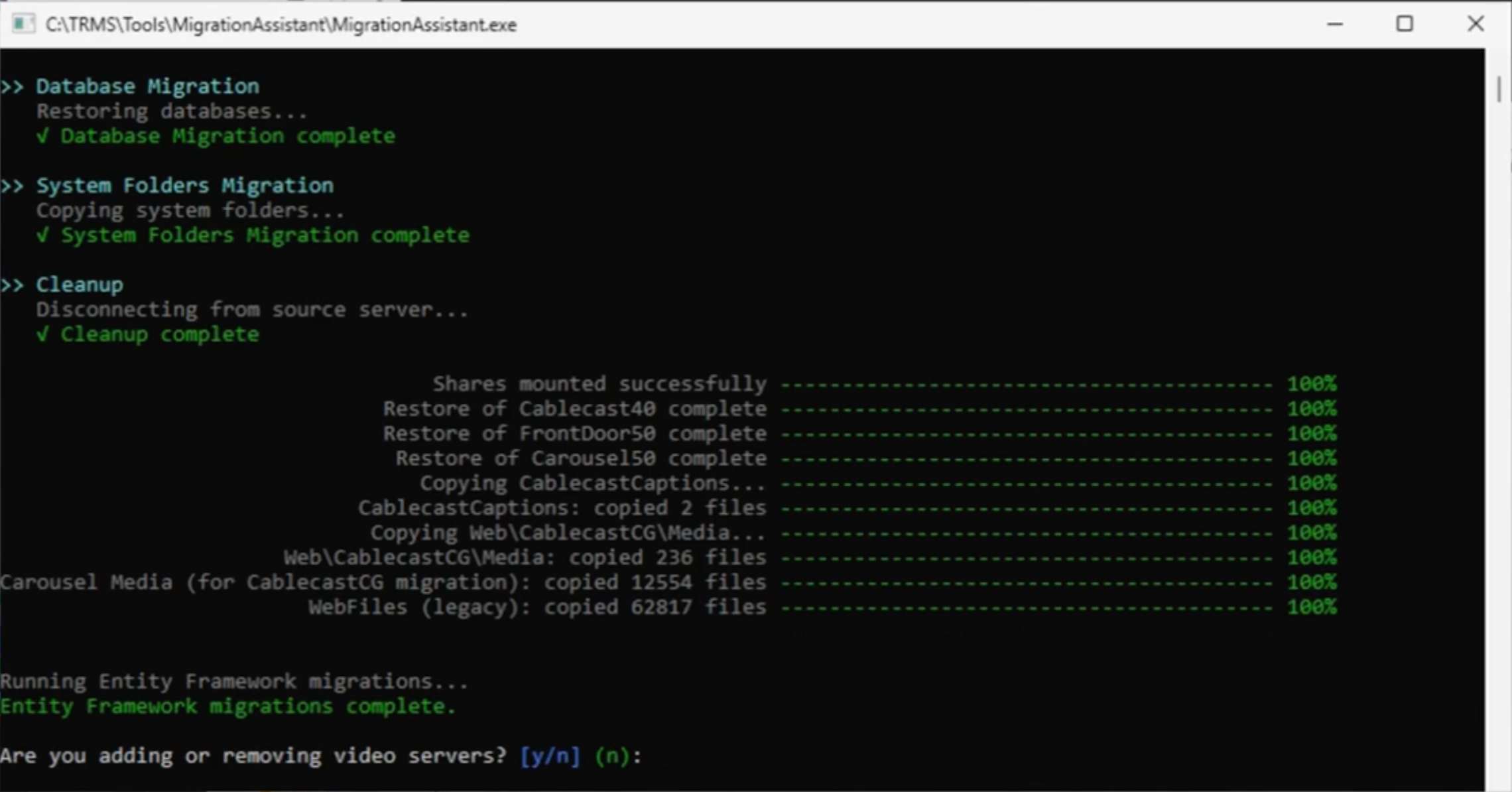 Migration Assistant command window showing completed database and file migrations at 100%.