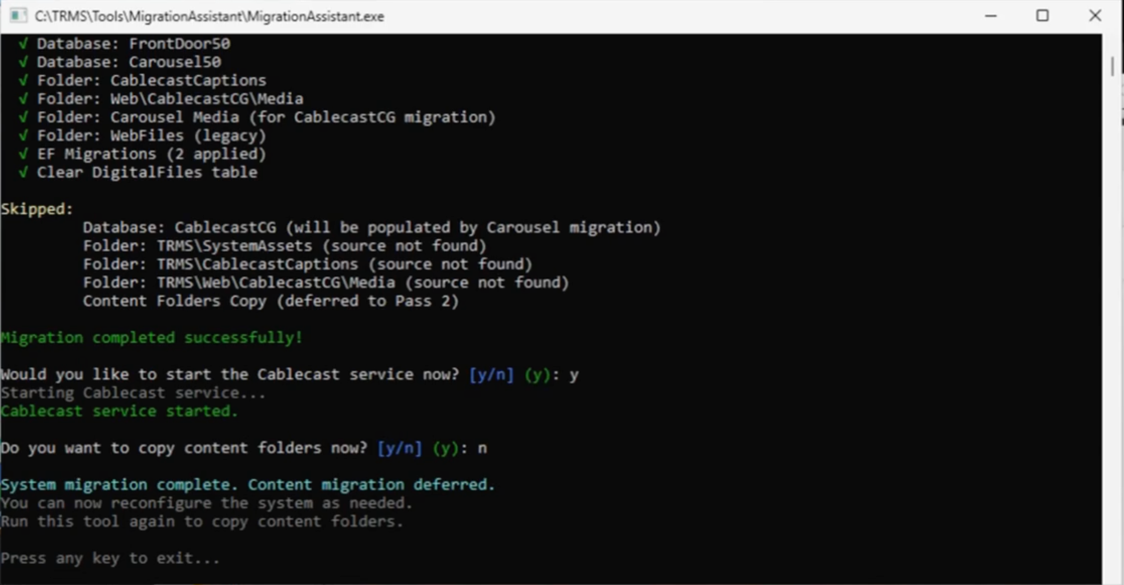 Migration Assistant command window showing system migration completed and content migration deferred.