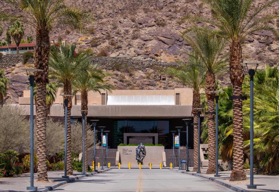 Entrance to the Palm Springs Art Museum framed by palm trees