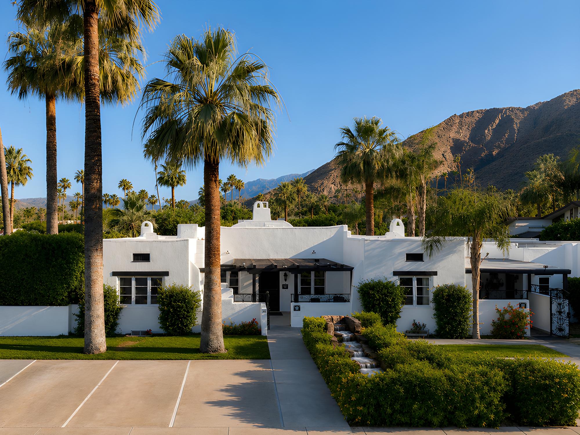 Spanish-Revival front entrance of Gloria Palm Springs, a downtown Palm Springs boutique hotel