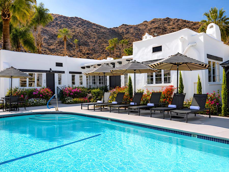 Poolside loungers beside the private pool at Gloria Palm Springs