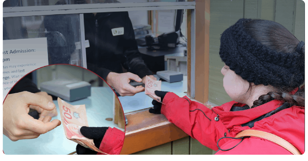 A visitor pays at the Toronto Zoo admission window