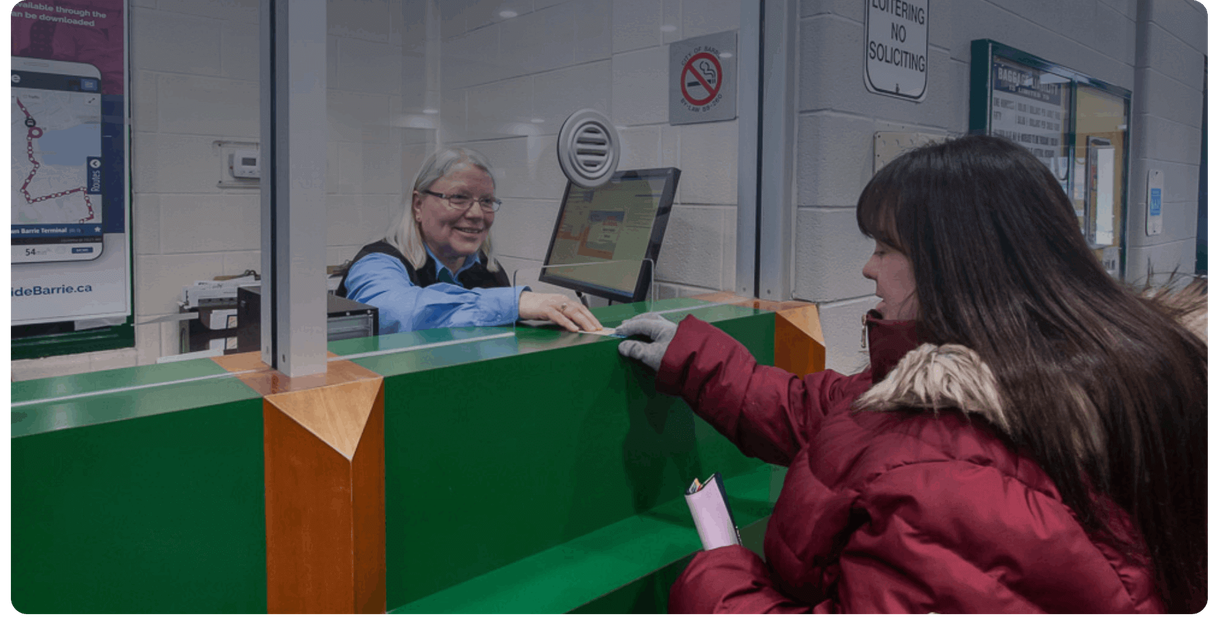 A rider buys a pass at the Barrie Transit ticket window