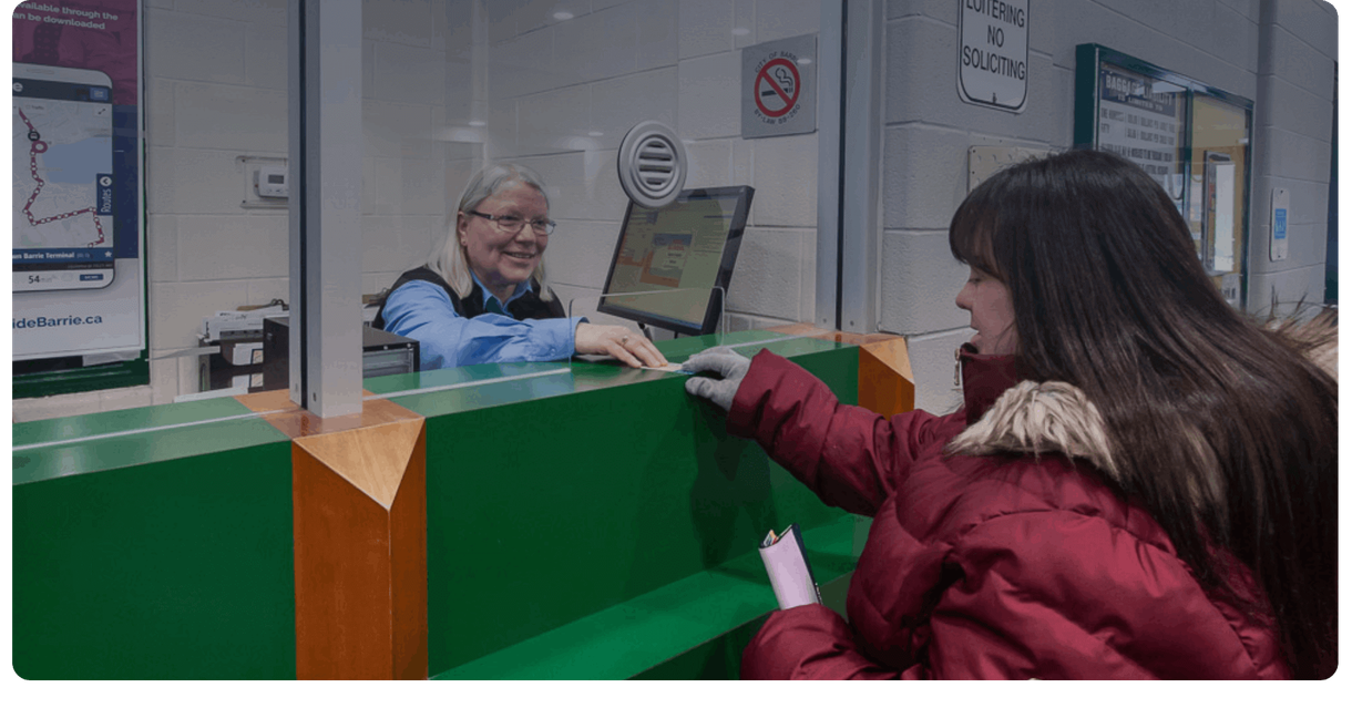 A rider buys a pass at the Barrie Transit ticket window