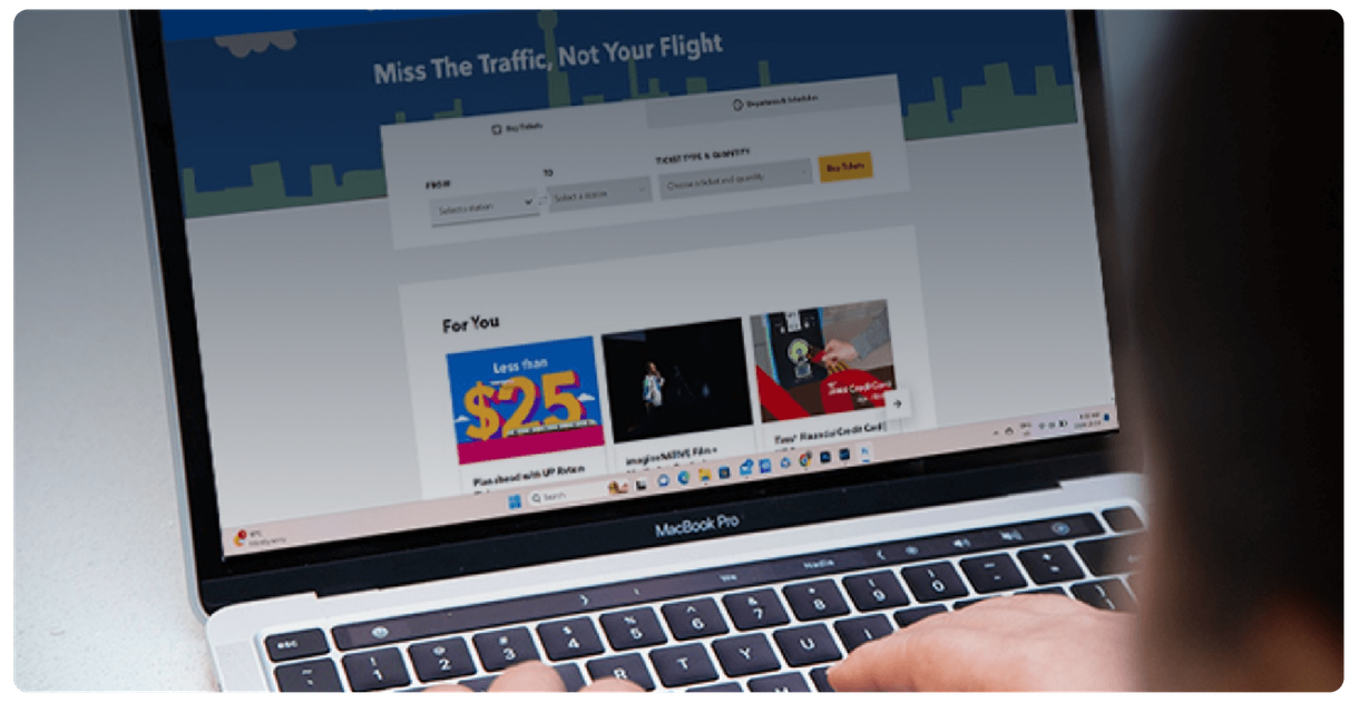 A laptop showing the UP Express website